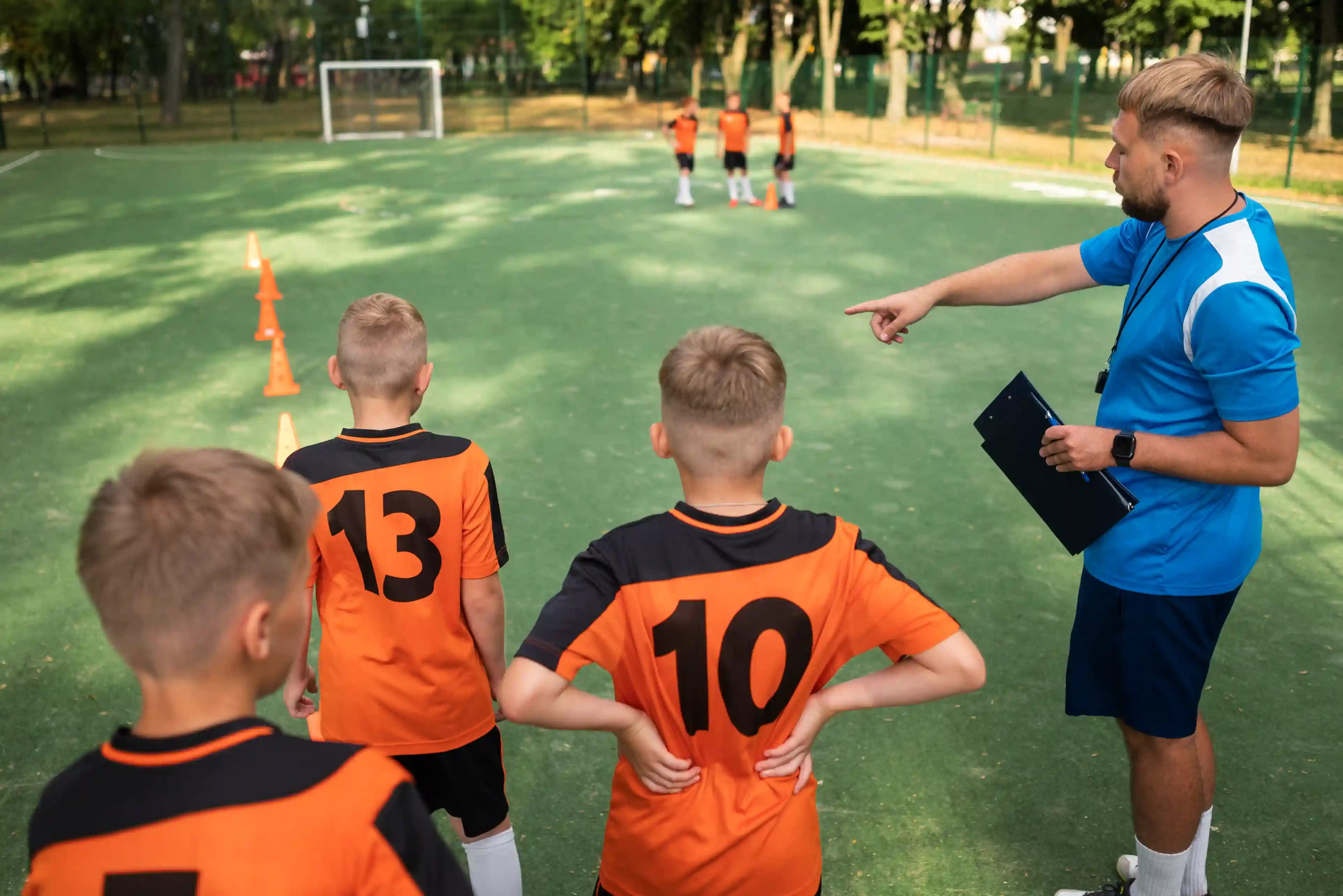 Football team warming up on a premium Footballs Bites field